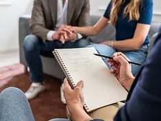 Notes being taken during a group counseling session