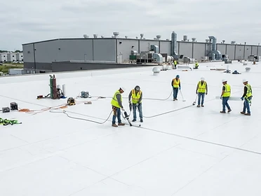 Commercial flat roof membrane installation