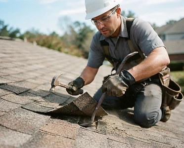 Roofer performing targeted shingle repair