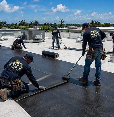 Jeff's Roofing crew of five installing a torch-down membrane on a large commercial flat roof