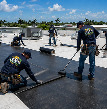 Jeff's Roofing crew of five installing a torch-down membrane on a large commercial flat roof
