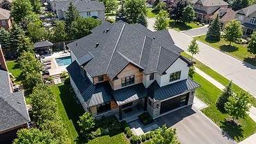 Newly installed residential roof with aligned architectural shingles