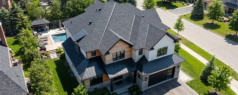 Newly installed residential roof with aligned architectural shingles