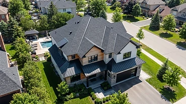 Completed residential roof replacement with aligned shingles