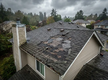 Storm-damaged roof before repair