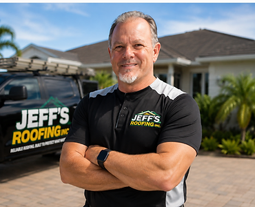 Jeff's Roofing owner posing with arms crossed beside the company truck