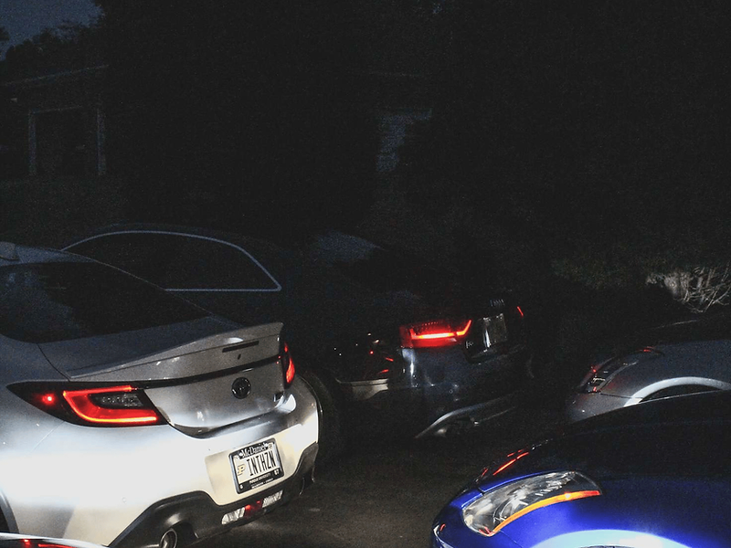 Night lineup, taillights glowing