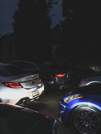 Night lineup, taillights glowing