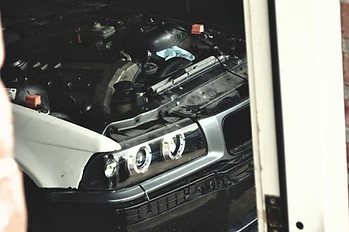 Silver BMW project car in the garage