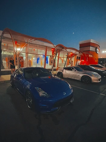 Z cars lined up under the vacuum canopy