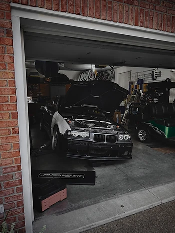E36 in the garage at night