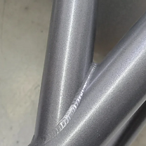 Powder-coated TIG-welded cage joint
