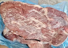 GFS Brazilian Frozen Beef vacuum packed frozen beef inside an open export carton