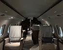 AeroForm aircraft carpet cleaning — private jet cabin aisle with light carpeting renewed by shampoo and hot-water extraction in Monterey, CA