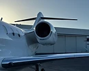 AeroForm exterior aircraft detailing — close-up of a private jet engine and tail section polished on the ramp near a hangar in Monterey, CA