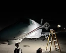 AeroForm full aircraft detailing — white business jet on the tarmac at night under work lights, complete interior and exterior detail at Monterey Regional Airport (MRY)