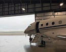 AeroForm rinseless aircraft washing — Embraer Praetor 600 in a hangar at Monterey Regional Airport (MRY), water-restricted rinseless wash