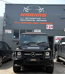 Karims Auto Repairs storefront with a Mercedes G-Class parked out front