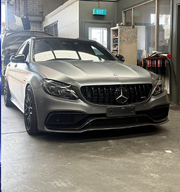 Grey Mercedes-AMG sedan inside the Karims workshop