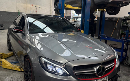 Mercedes-Benz C63 AMG up on jacks for servicing