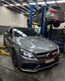 Mercedes-Benz C63 AMG up on jacks for servicing