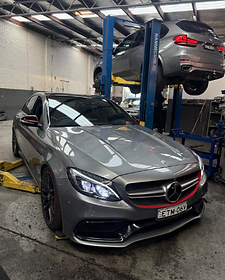 Mercedes-Benz C63 AMG up on jacks for servicing