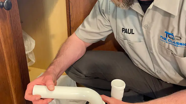 Connecting a dishwasher supply line and drain hose with proper high loop
