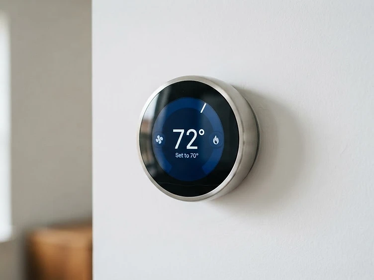 Modern smart thermostat representing home comfort control