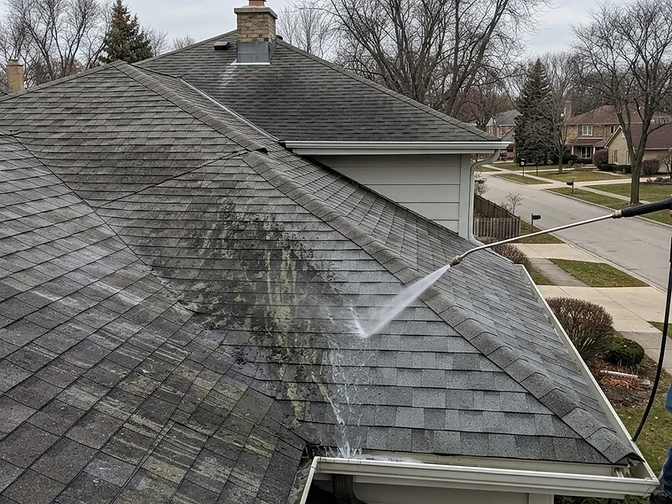 Illustrative photo of soft wash roof cleaning on a suburban home in the Bartlett Illinois area