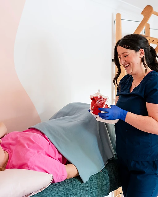 Woman practising gentle movement and pelvic health rehabilitation