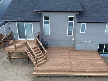 Finished wood deck with stairs and railing