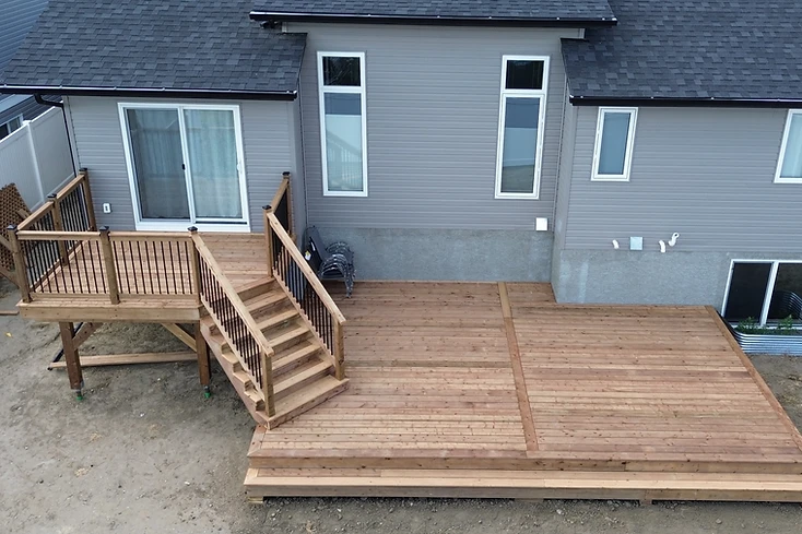 Finished wood deck with stairs and railing