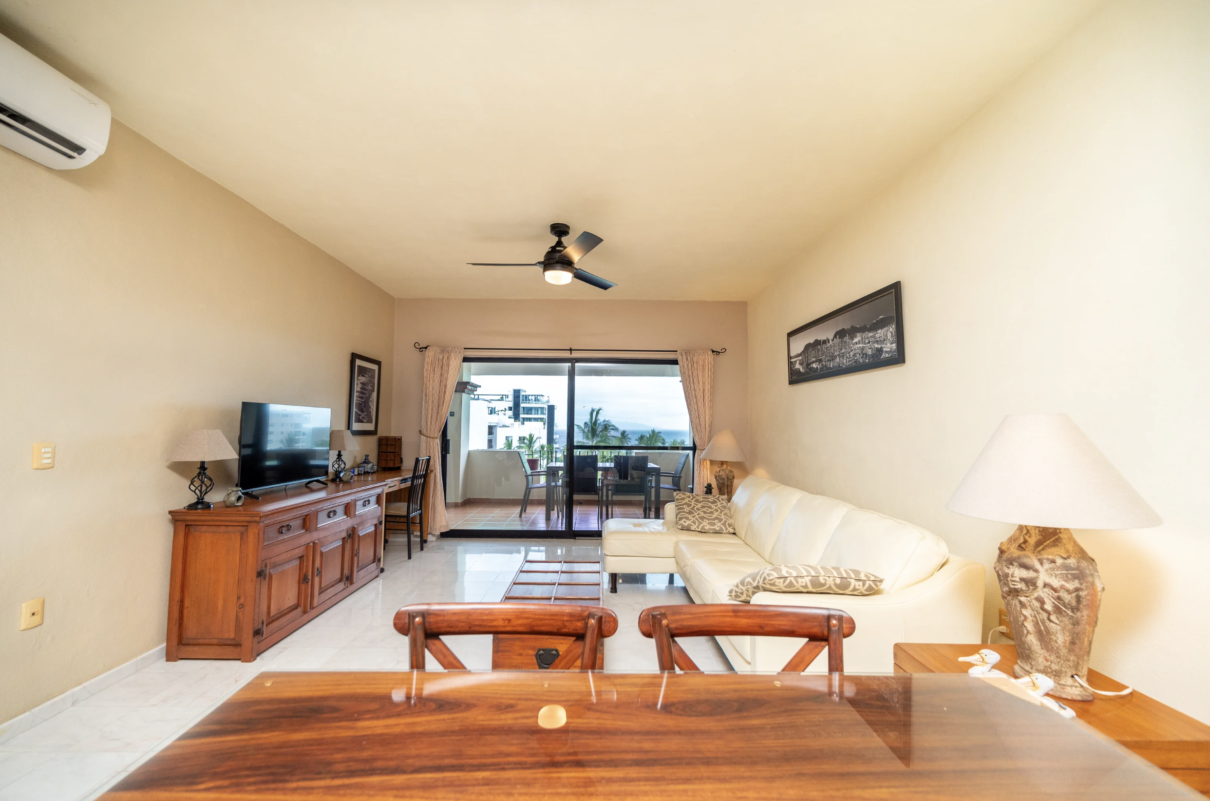 Velmar Penthouse living and dining area opening to terrace