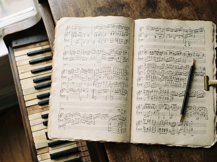 Manuscript paper and pen