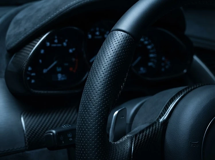 Macro detail of a hand-stitched luxury steering wheel