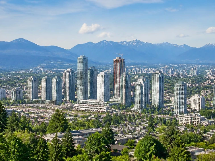 The Lower Mainland skyline with the North Shore mountains behind it on a clear day