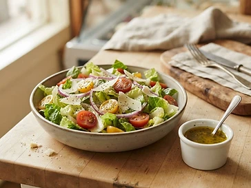 Fresh garden salad bowl with cherry tomatoes and shaved parmesan