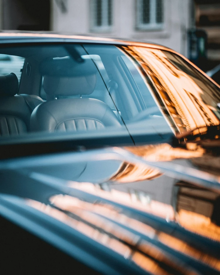 A freshly finished windshield glowing in golden-hour light