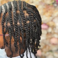 Medium-length rope twists with pink-framed glasses