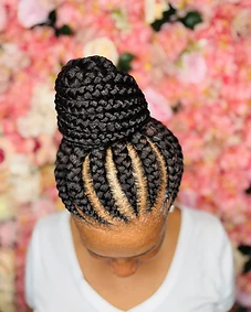 Top-knot bun styled from uniform straight-back braids