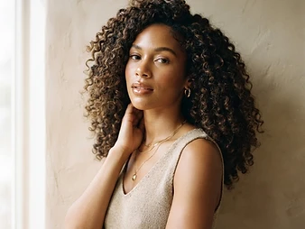 Portrait of a model with voluminous curly crochet braids