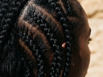 Macro close-up of stitch braids with precise geometric parting