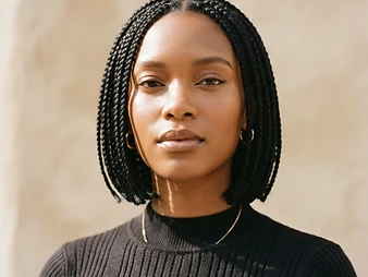 Portrait of short chin-length bob box braids framing the face