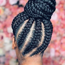 Braided high bun with vertical tracks converging at the crown