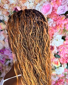 Close-up of box braids with a light ombre finish toward the ends