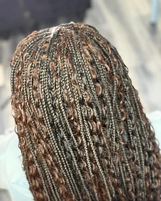 Micro braids with copper-auburn highlights