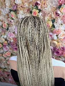 Long blonde box braids with darker roots