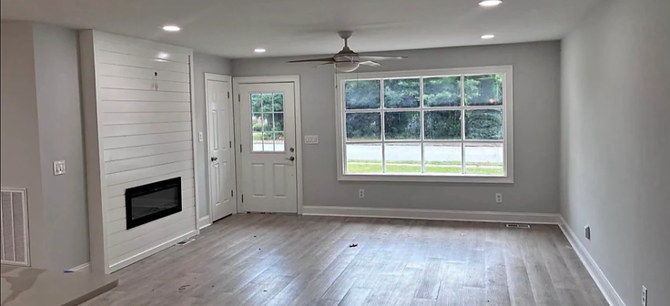Finished shiplap fireplace wall with fresh paint
