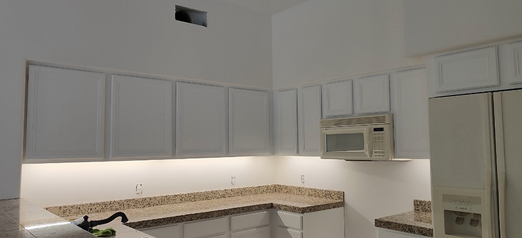 Finished kitchen with white shaker cabinets