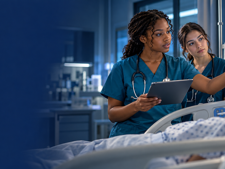 Nurses at the bedside monitoring a patient